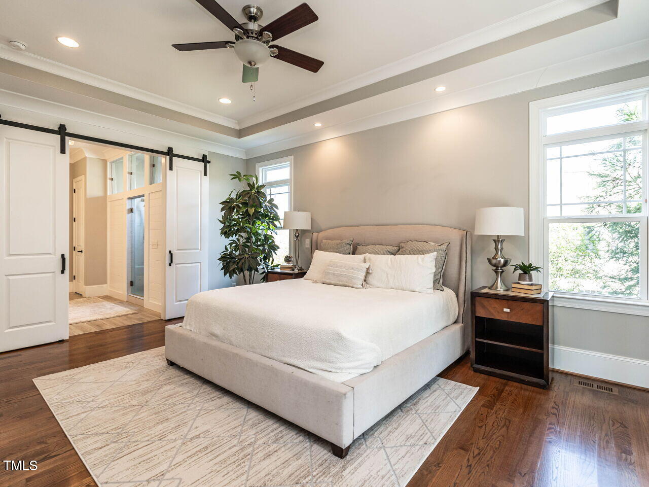 7312 Ridgeline Drive Raleigh, NC 27613 - Photo 24 of 83 a large bedroom with a bed and a large window