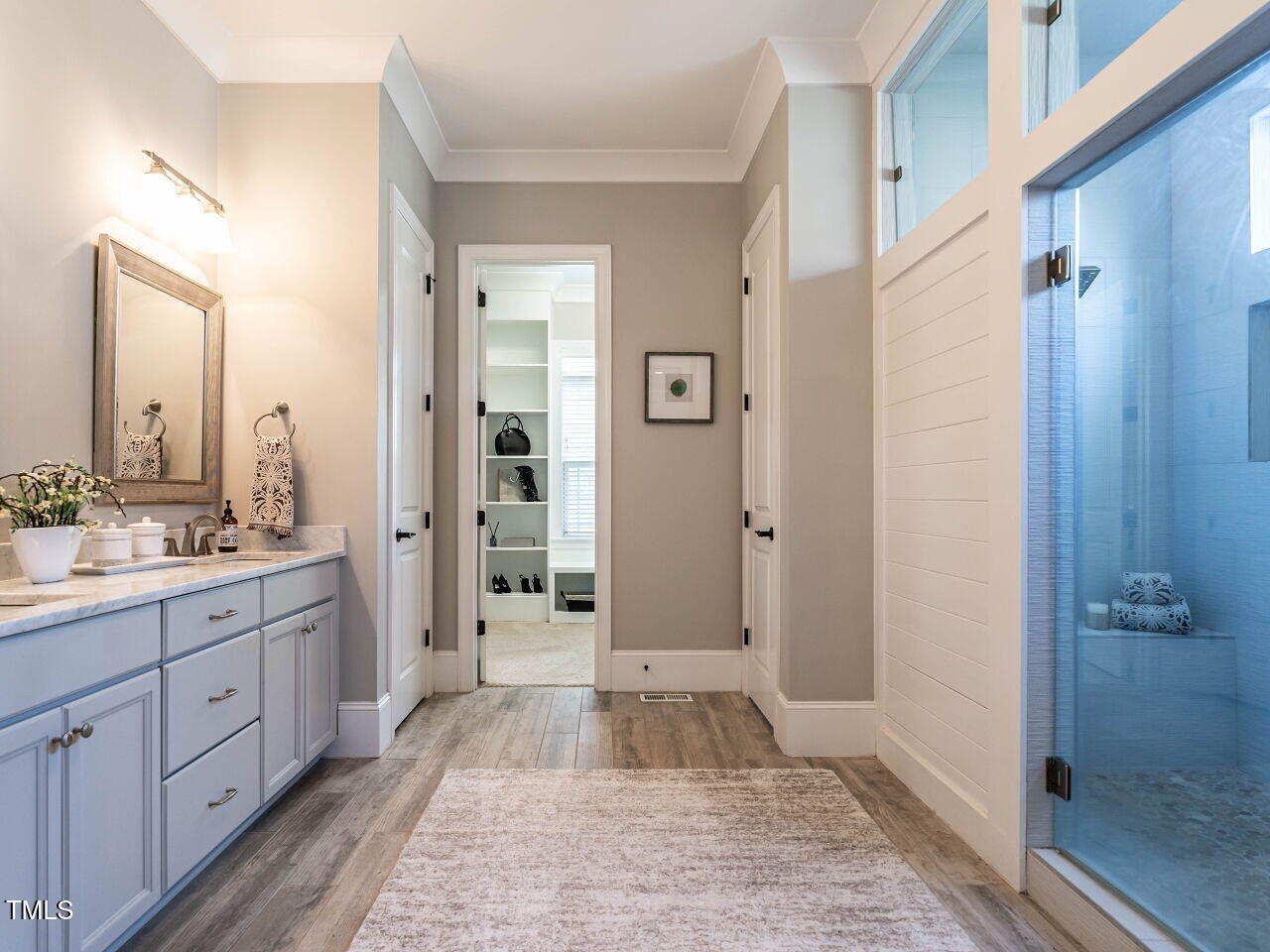 7312 Ridgeline Drive Raleigh, NC 27613 - Photo 25 of 83 a bathroom with a granite countertop sink mirror and a shower
