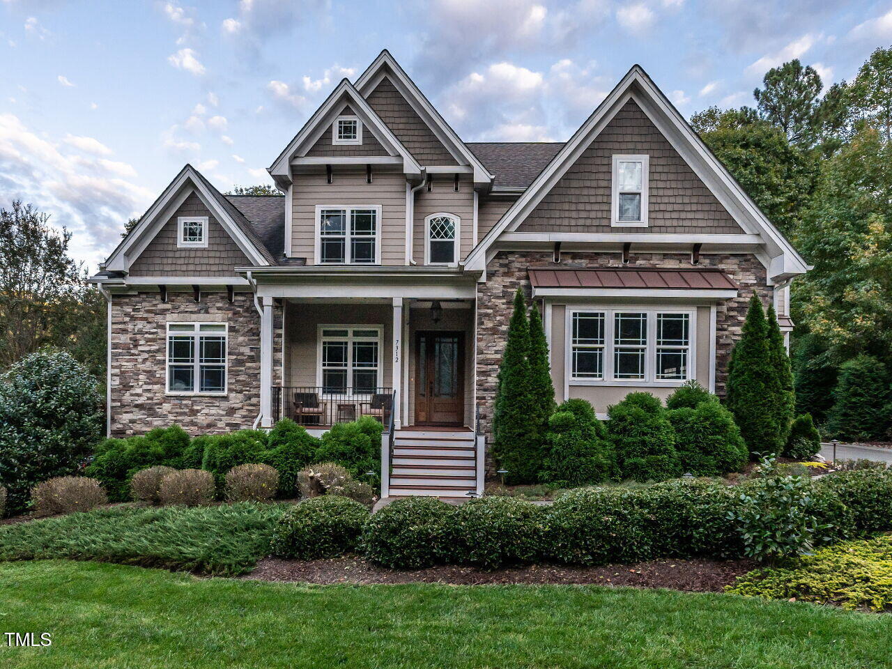 7312 Ridgeline Drive Raleigh, NC 27613 - Photo 2 of 83 a front view of a house with a yard and trees
