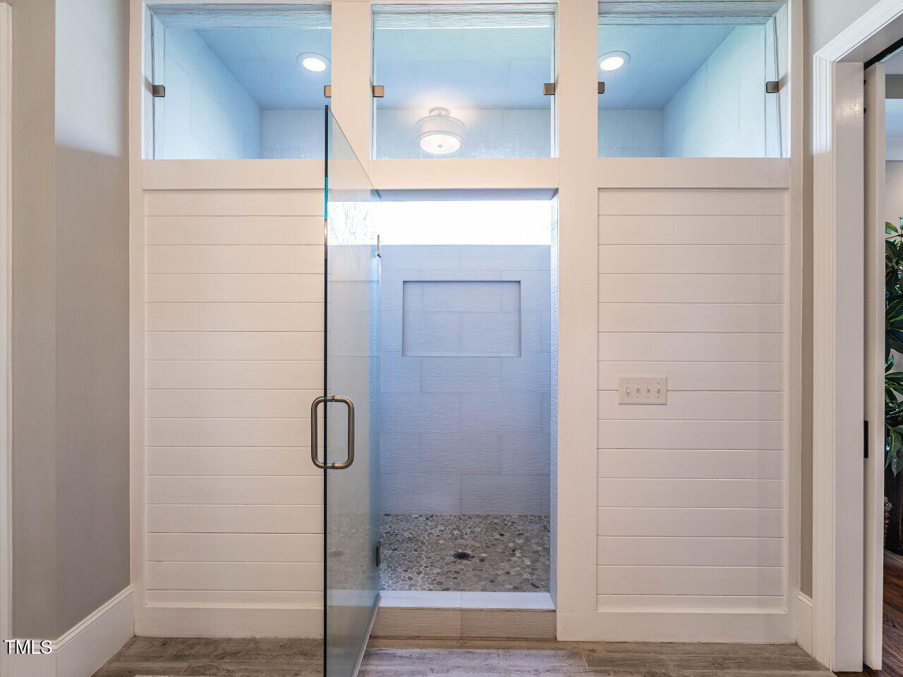 7312 Ridgeline Drive Raleigh, NC 27613 - Photo 27 of 83 a bathroom with a glass shower door