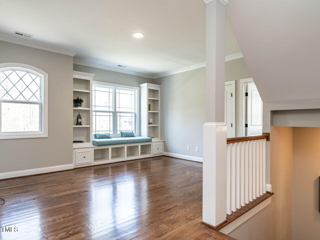 7312 Ridgeline Drive Raleigh, NC 27613 - Photo 29 of 83 an empty room with wooden floor and windows