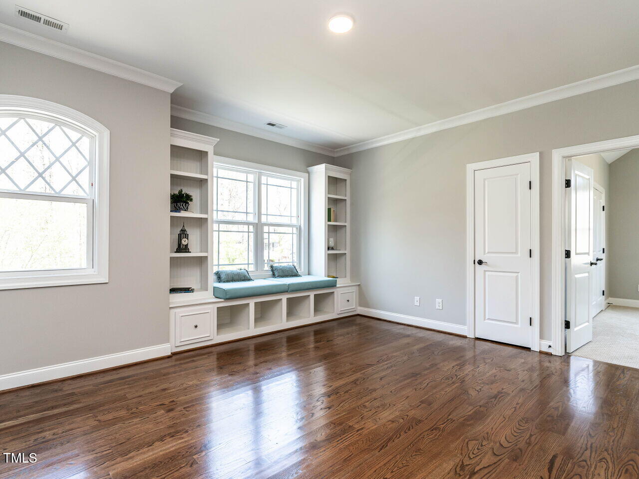 7312 Ridgeline Drive Raleigh, NC 27613 - Photo 30 of 83 an empty room with wooden floor and windows