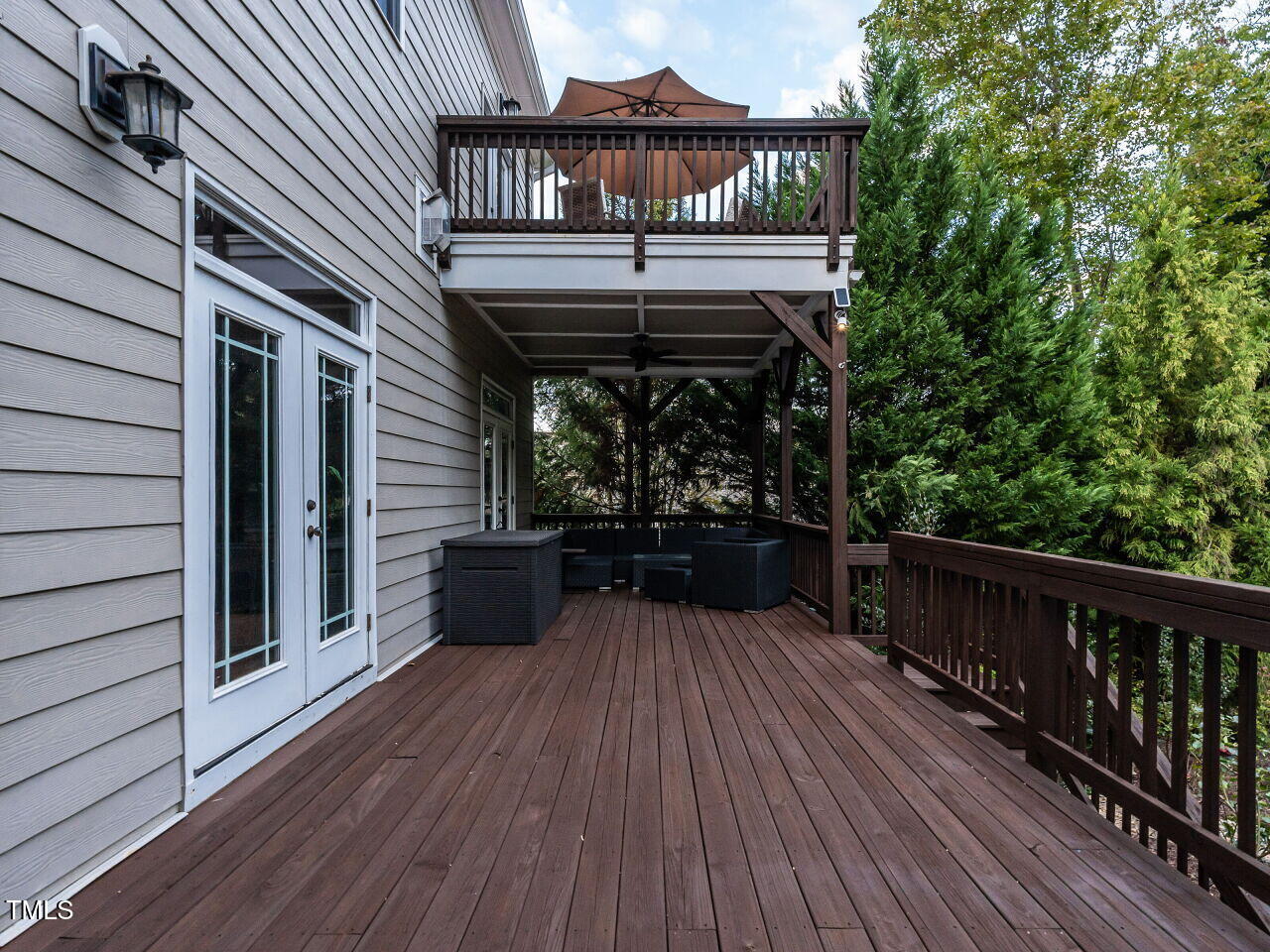 7312 Ridgeline Drive Raleigh, NC 27613 - Photo 62 of 83 a view of a balcony with wooden floor and iron stairs