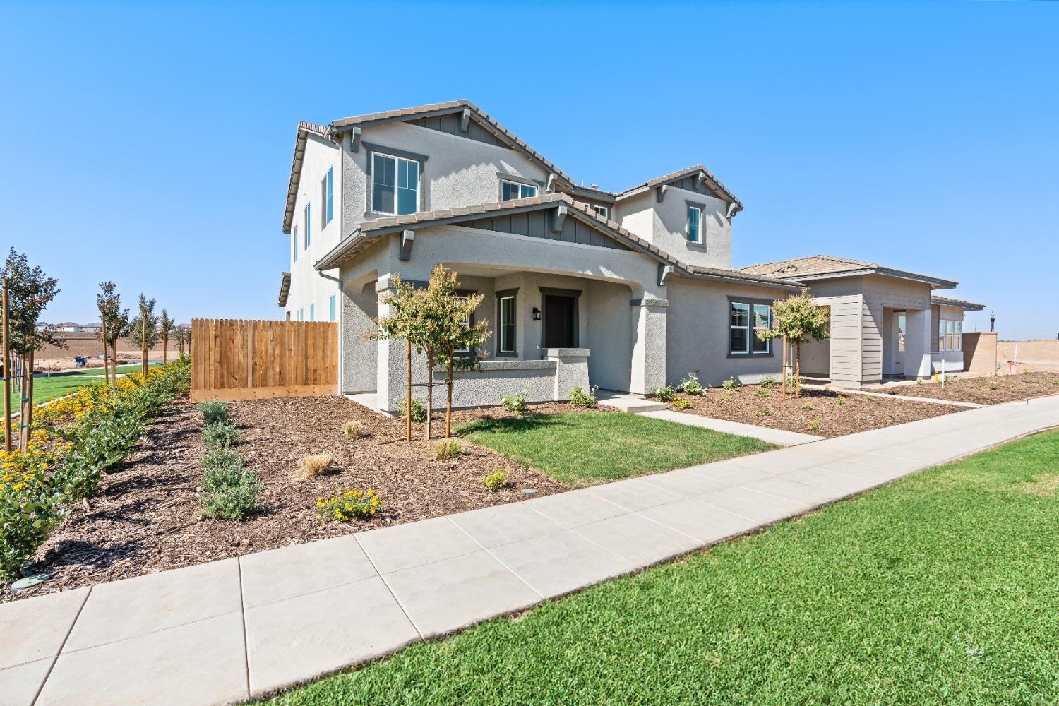 275 Huckleberry Road South Madera, CA 93636 - Photo 1 of 34 a front view of a house with garden