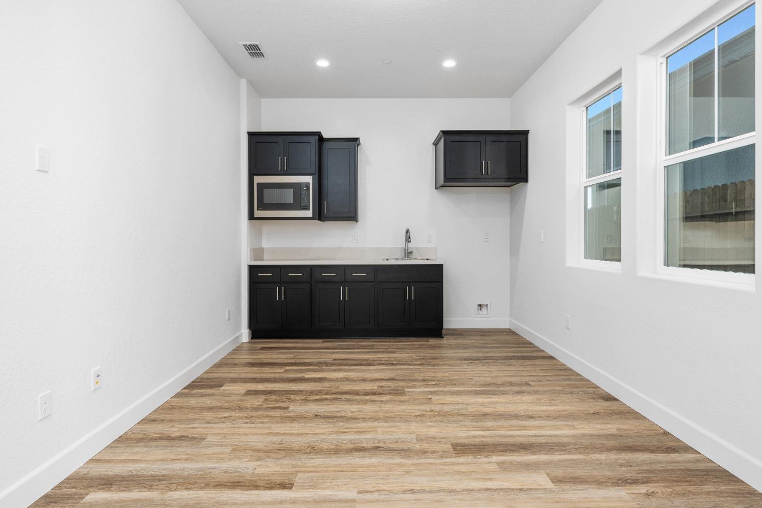 275 Huckleberry Road South Madera, CA 93636 - Photo 11 of 34 a spacious bathroom with a sink and a mirror