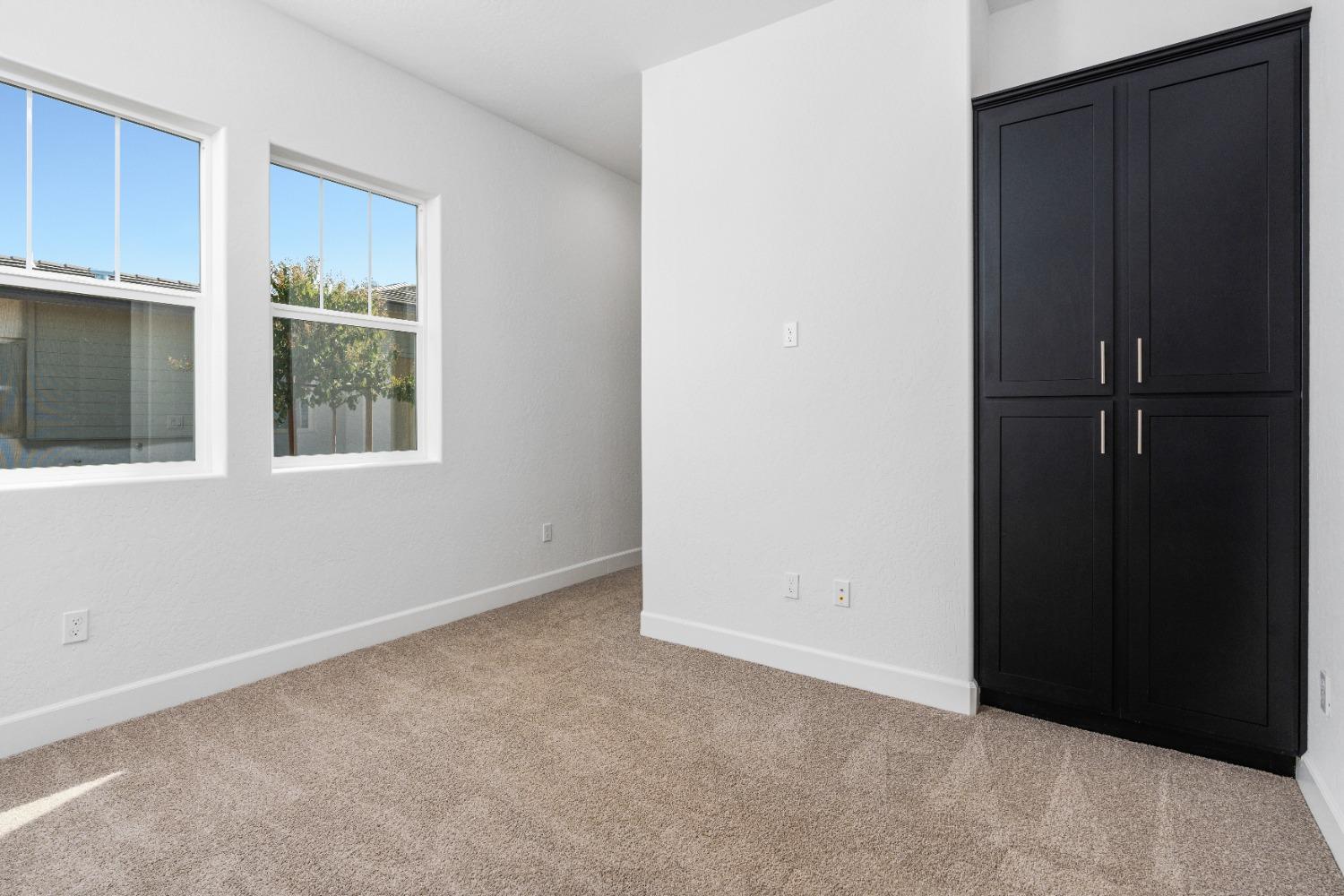 275 Huckleberry Road South Madera, CA 93636 - Photo 13 of 34 a view of an empty room with window and cabinet