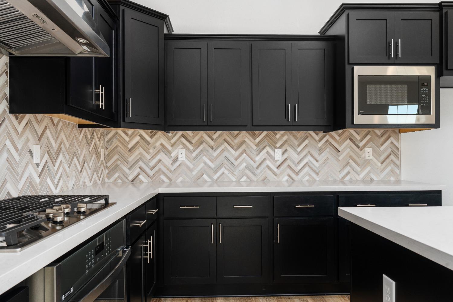 275 Huckleberry Road South Madera, CA 93636 - Photo 25 of 34 a kitchen with a sink and a stove