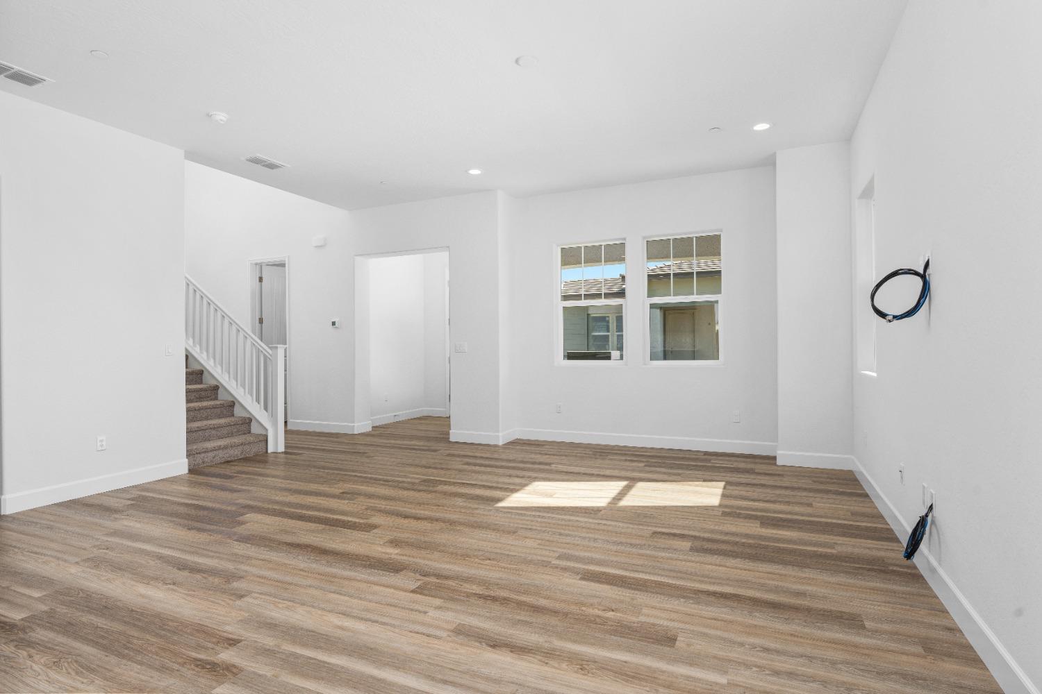 275 Huckleberry Road South Madera, CA 93636 - Photo 31 of 34 a view of an empty room with wooden floor and a window