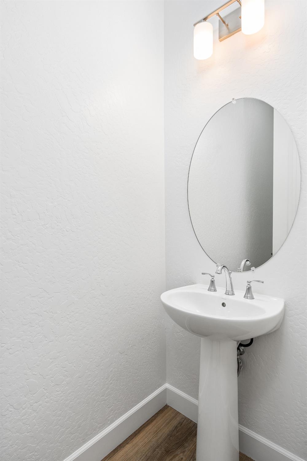 275 Huckleberry Road South Madera, CA 93636 - Photo 6 of 34 a bathroom with a sink and a mirror