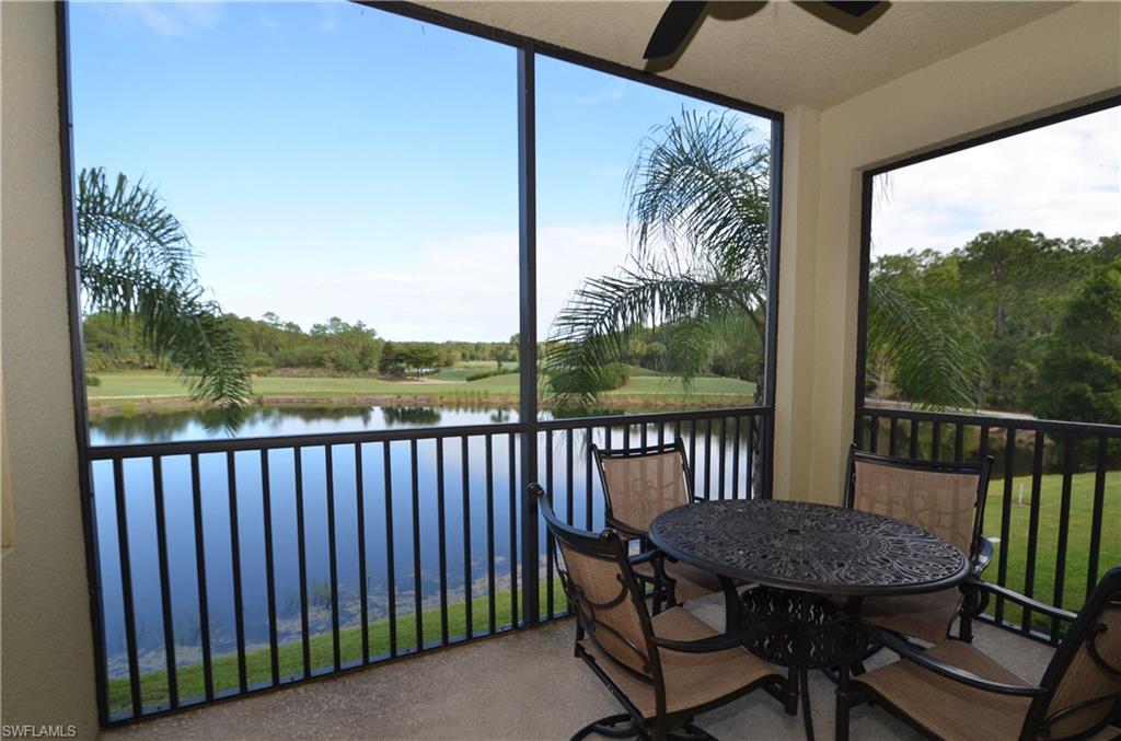 10353 Heritage Bay Boulevard, Unit 2226 Naples, FL 34120 - Photo 1 of 40 a view of a wooden bench on the roof deck