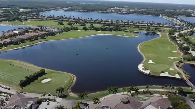 an aerial view of a house with a lake view
