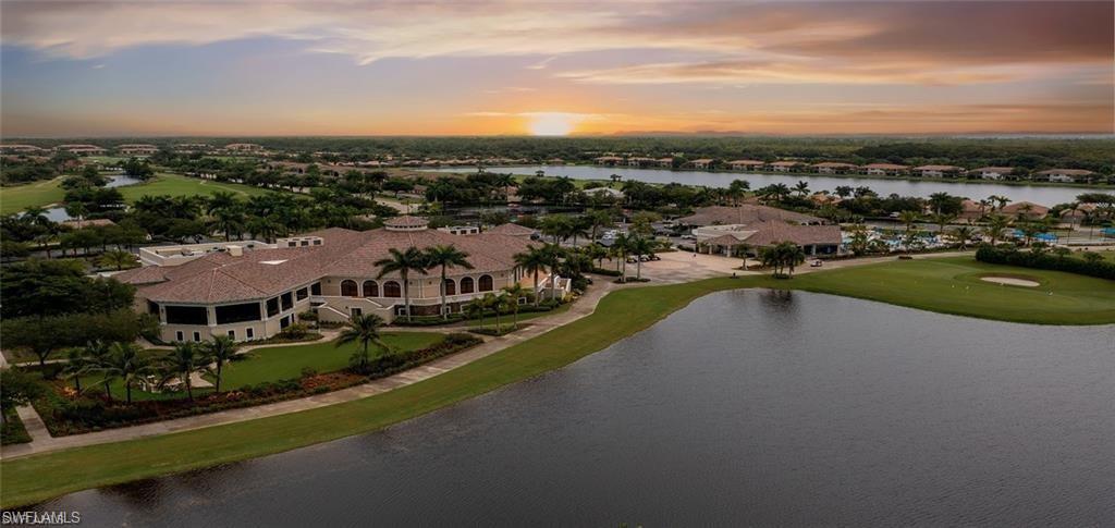 10353 Heritage Bay Boulevard, Unit 2226 Naples, FL 34120 - Photo 37 of 40 a view of a lake with a city