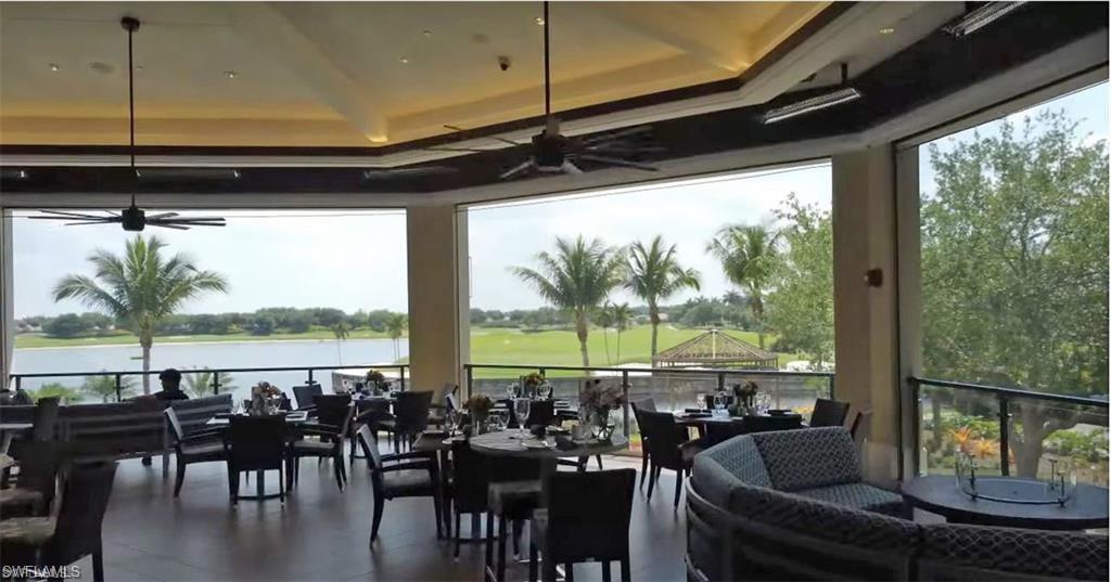 10353 Heritage Bay Boulevard, Unit 2226 Naples, FL 34120 - Photo 40 of 40 a view of a living room with furniture and floor to ceiling window