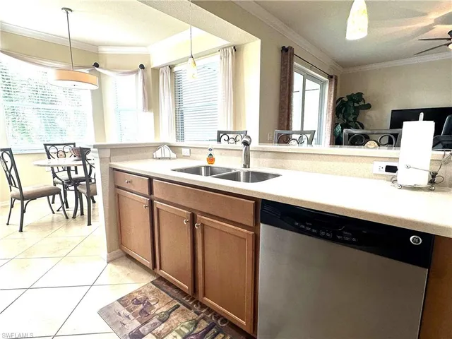 a kitchen with a sink and a window