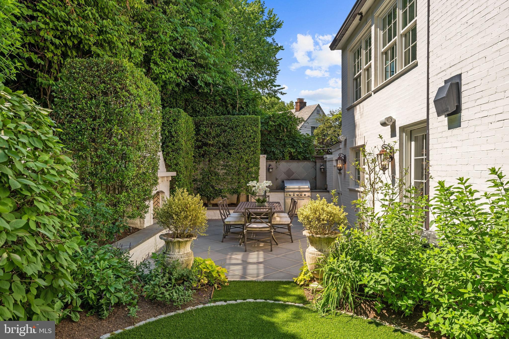 1726 Hoban Road Northwest Washington, DC 20007 - Photo 17 of 39 a view of a patio with couches chairs and a flower plants