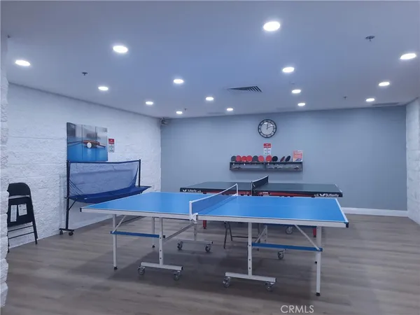 a living room with lots of furniture and chandelier