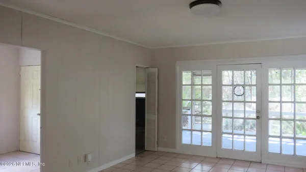 a view of an empty room with a window