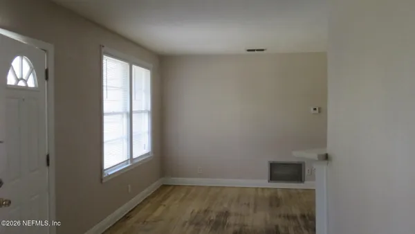 a view of an empty room with a window