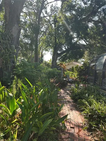 a backyard of a house with lots of green space