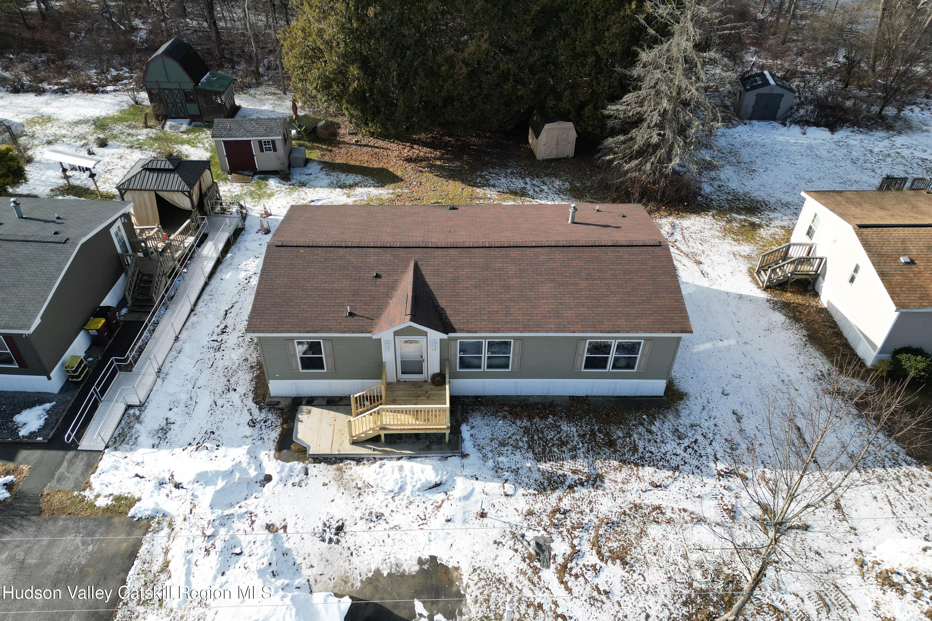 an aerial view of a house with a yard