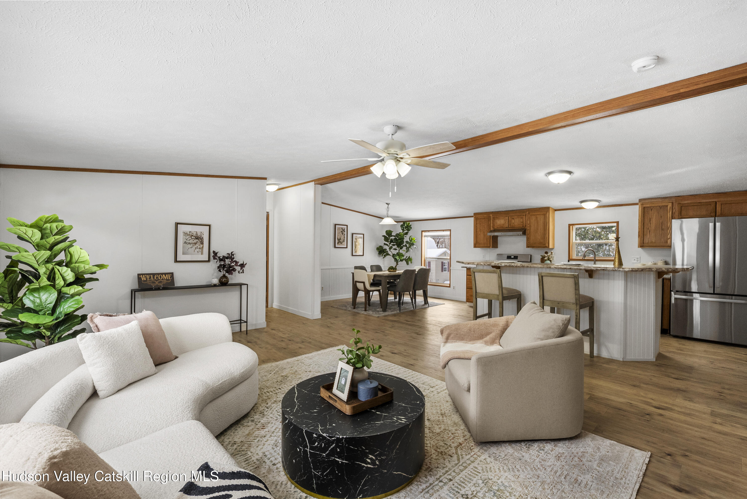 3701 Galway Road, Unit 5 Ballston Spa, NY 12020 - Photo 11 of 47 a living room with furniture and wooden floor