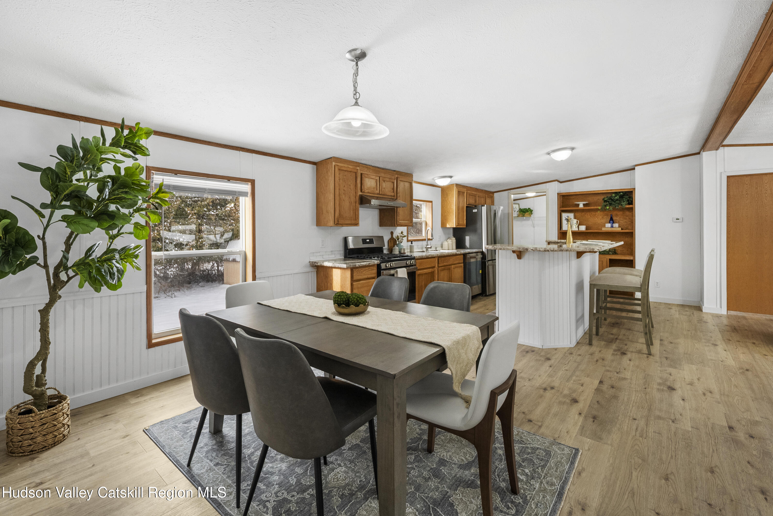 3701 Galway Road, Unit 5 Ballston Spa, NY 12020 - Photo 13 of 47 a view of a dining room with furniture window and wooden floor