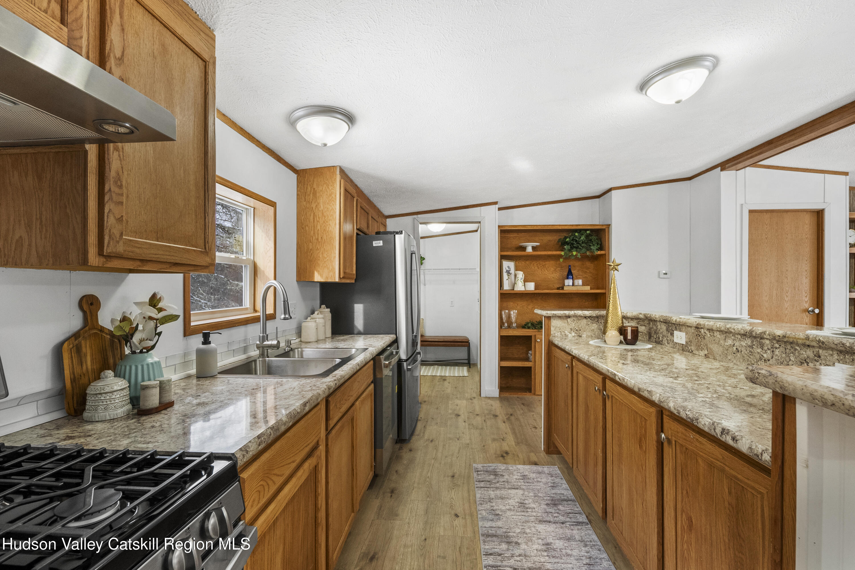 3701 Galway Road, Unit 5 Ballston Spa, NY 12020 - Photo 14 of 47 a kitchen with stainless steel appliances granite countertop a sink stove and refrigerator
