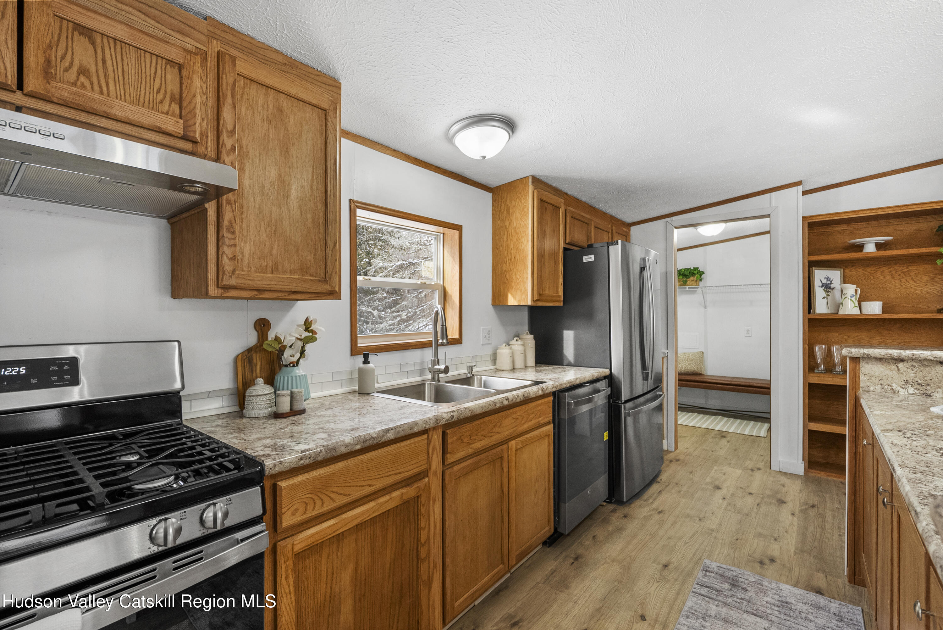 3701 Galway Road, Unit 5 Ballston Spa, NY 12020 - Photo 20 of 47 a kitchen with a stove a sink and a refrigerator