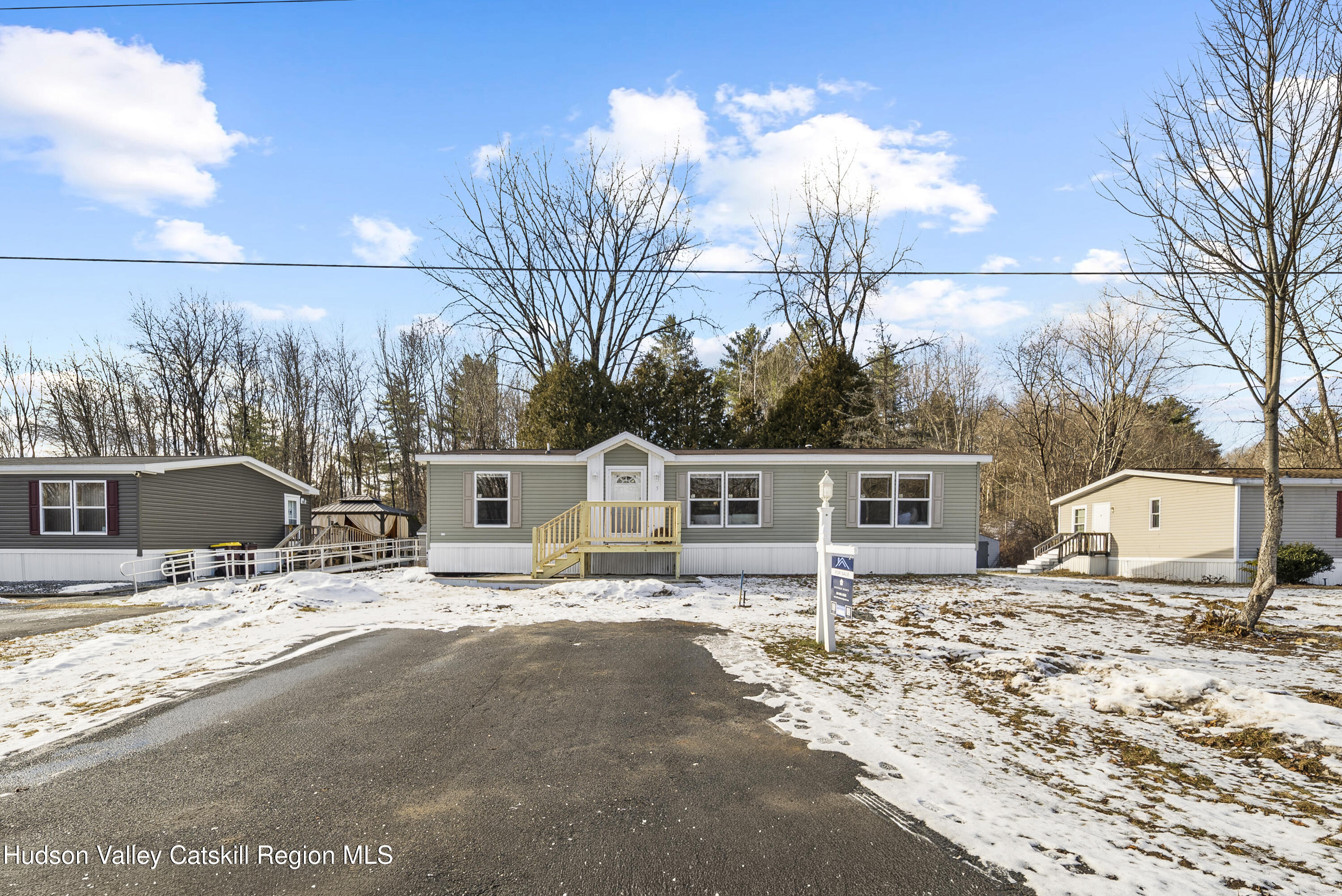 3701 Galway Road, Unit 5 Ballston Spa, NY 12020 - Photo 2 of 47 a view of a terrace with a bench and floor to ceiling window