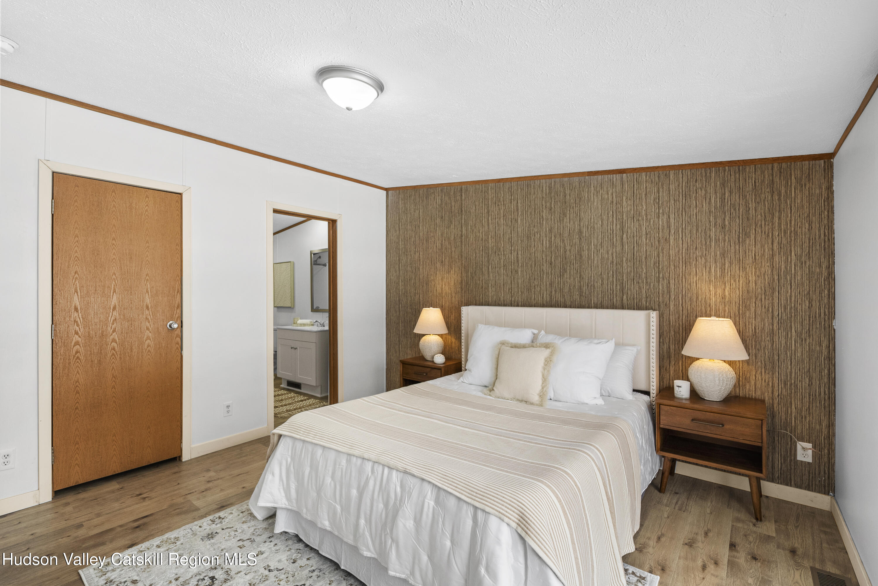 3701 Galway Road, Unit 5 Ballston Spa, NY 12020 - Photo 25 of 47 a bedroom with a bed and wooden floor