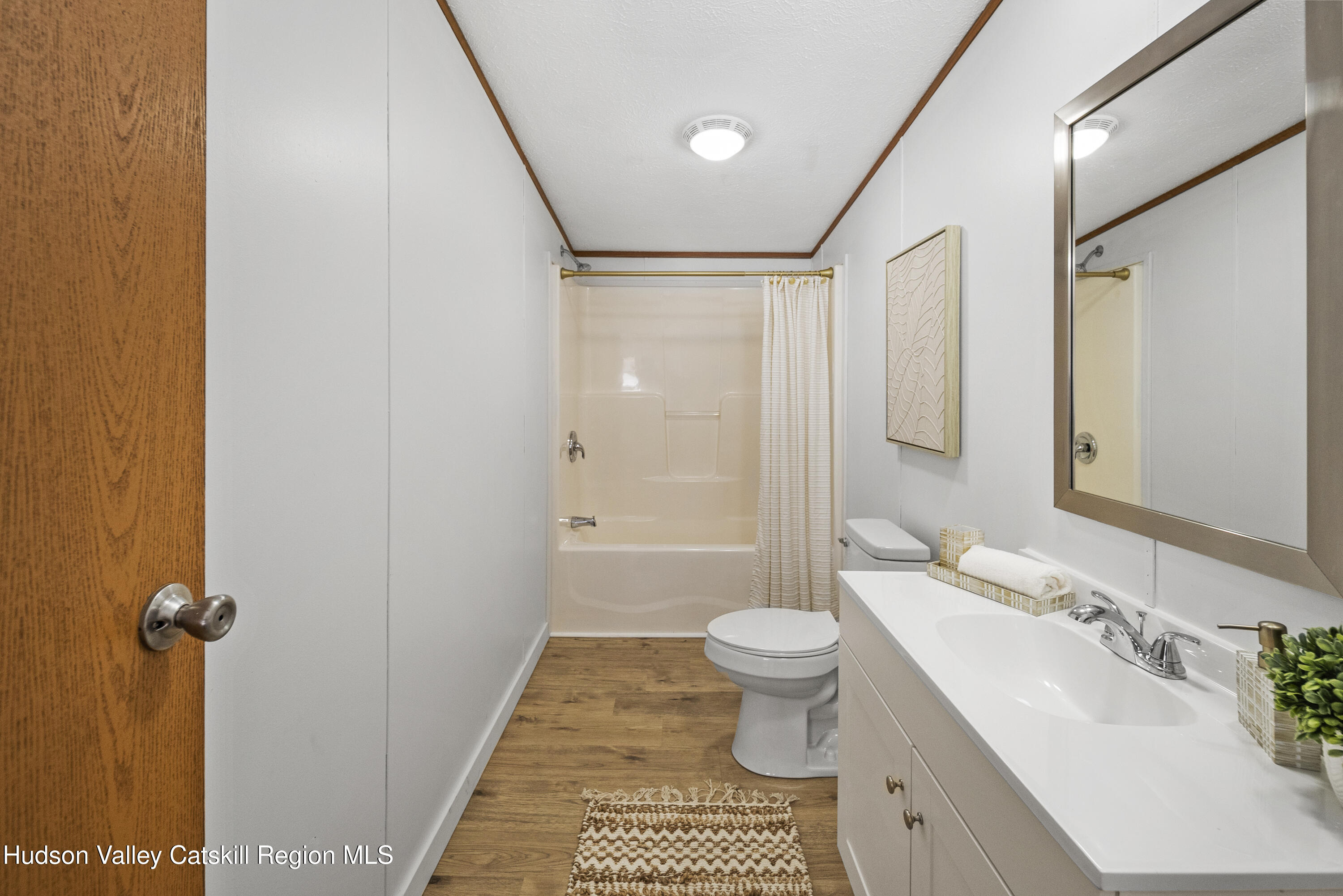 3701 Galway Road, Unit 5 Ballston Spa, NY 12020 - Photo 28 of 47 a bathroom with a sink toilet a mirror and shower