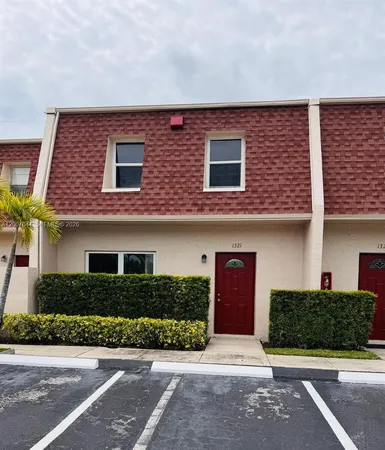 a front view of a house with garage