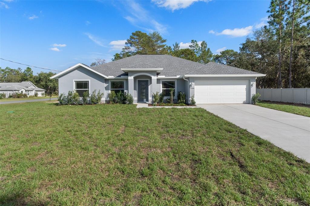 36 Cactus Street Homosassa, FL 34446 - Photo 1 of 1 a front view of a house with yard