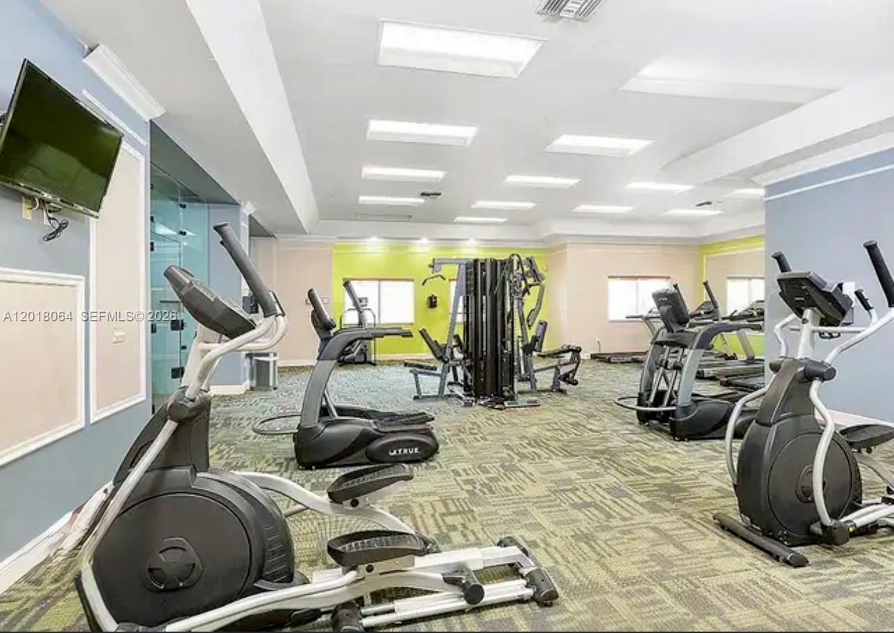 16213 Emerald Cove Road Weston, FL 33331 - Photo 27 of 27 a view of a room with gym equipment