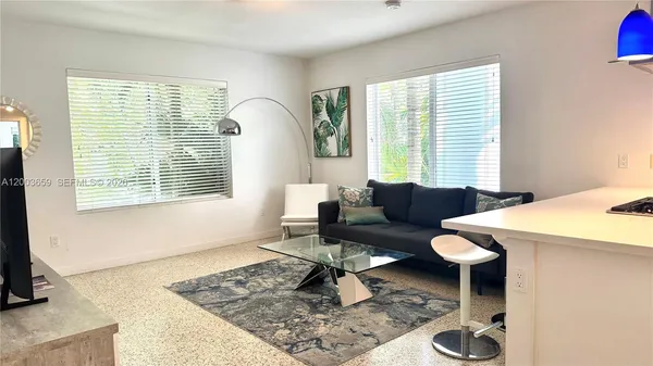 a living room with furniture and a window