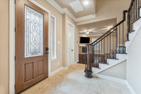a view of entryway with wooden floor and windows