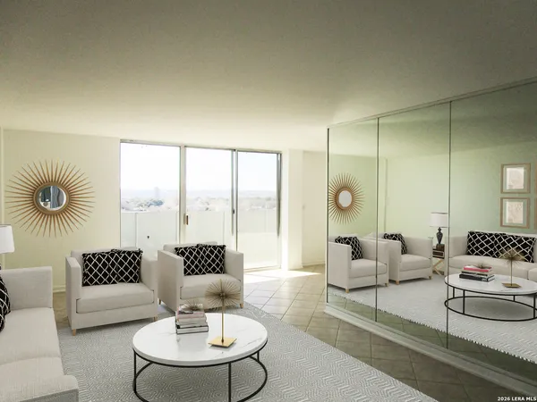 a living room with furniture and a large window