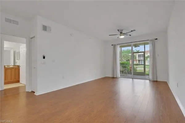 a view of an empty room with a window
