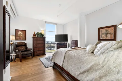a bedroom with a bed and a television in it