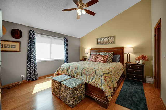 a bedroom with a bed and dresser