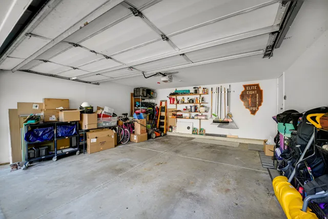 a view of a garage with a bike and car