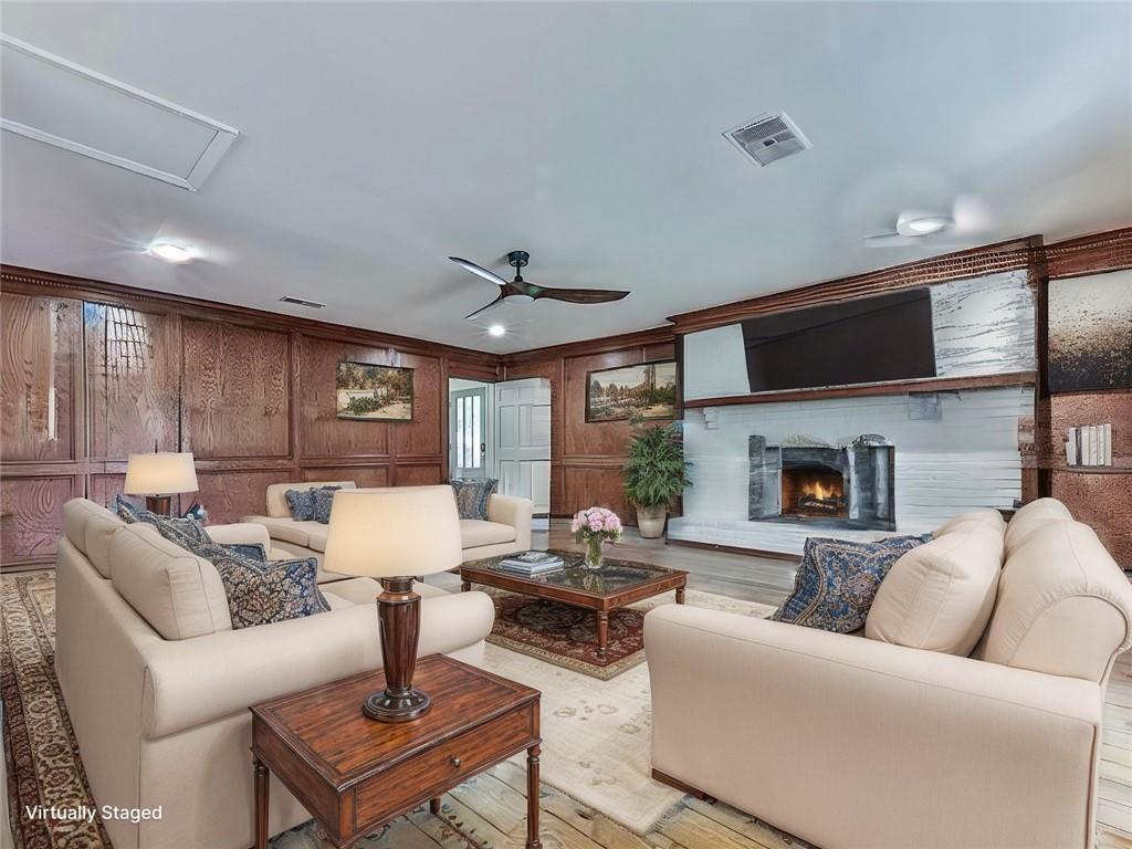 633 Butterworth Road Canton, GA 30114 - Photo 14 of 55 a living room with furniture fireplace and a flat screen tv