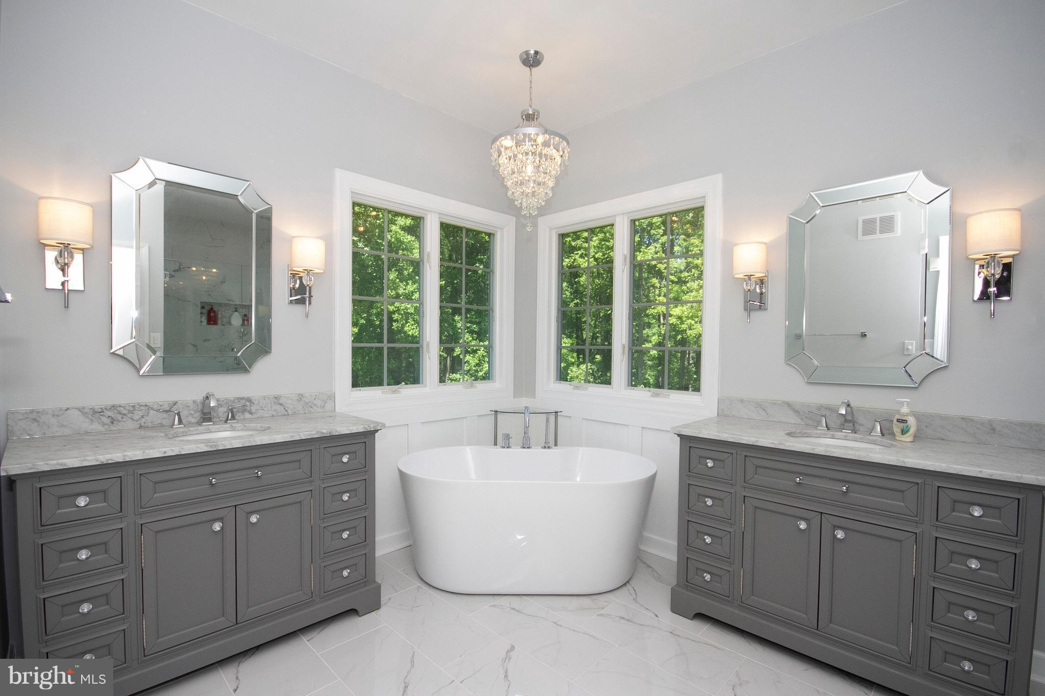 2818 Paper Mill Road Phoenix, MD 21131 - Photo 14 of 30 a spacious bathroom with a granite countertop tub sink and mirror