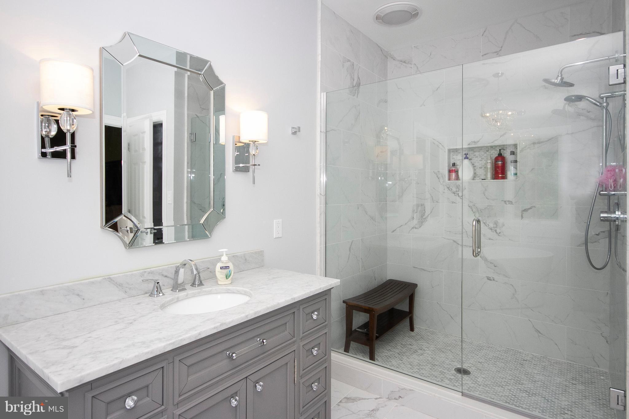 2818 Paper Mill Road Phoenix, MD 21131 - Photo 15 of 30 a bathroom with a granite countertop sink mirror and shower