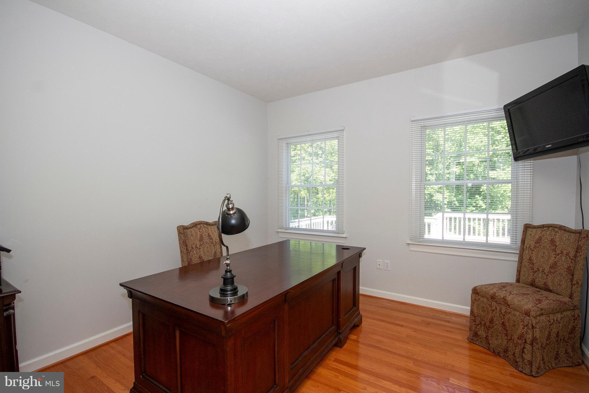 2818 Paper Mill Road Phoenix, MD 21131 - Photo 16 of 30 a living room with furniture and a flat screen tv