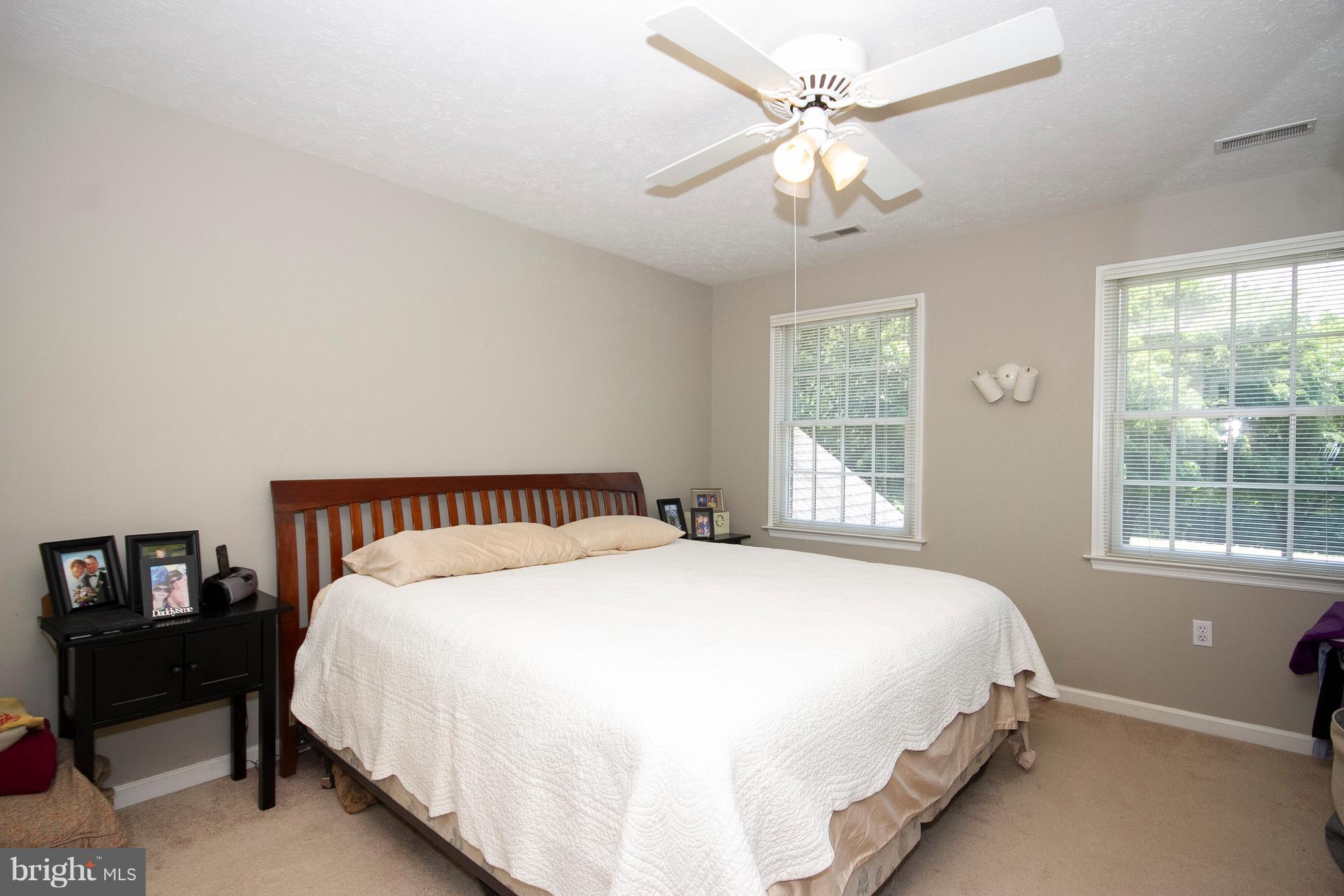 2818 Paper Mill Road Phoenix, MD 21131 - Photo 20 of 30 a large bed sitting in a bedroom next to a window