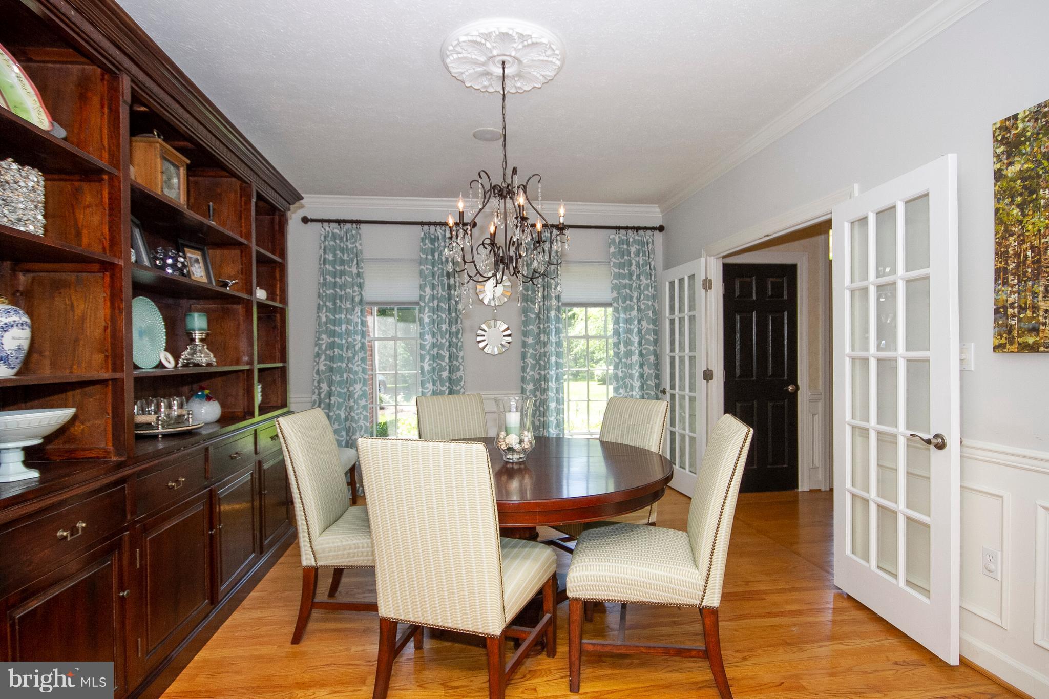2818 Paper Mill Road Phoenix, MD 21131 - Photo 8 of 30 a dining room with furniture a rug and wooden floor