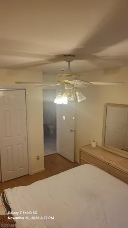 a view of a hallway to a bedroom