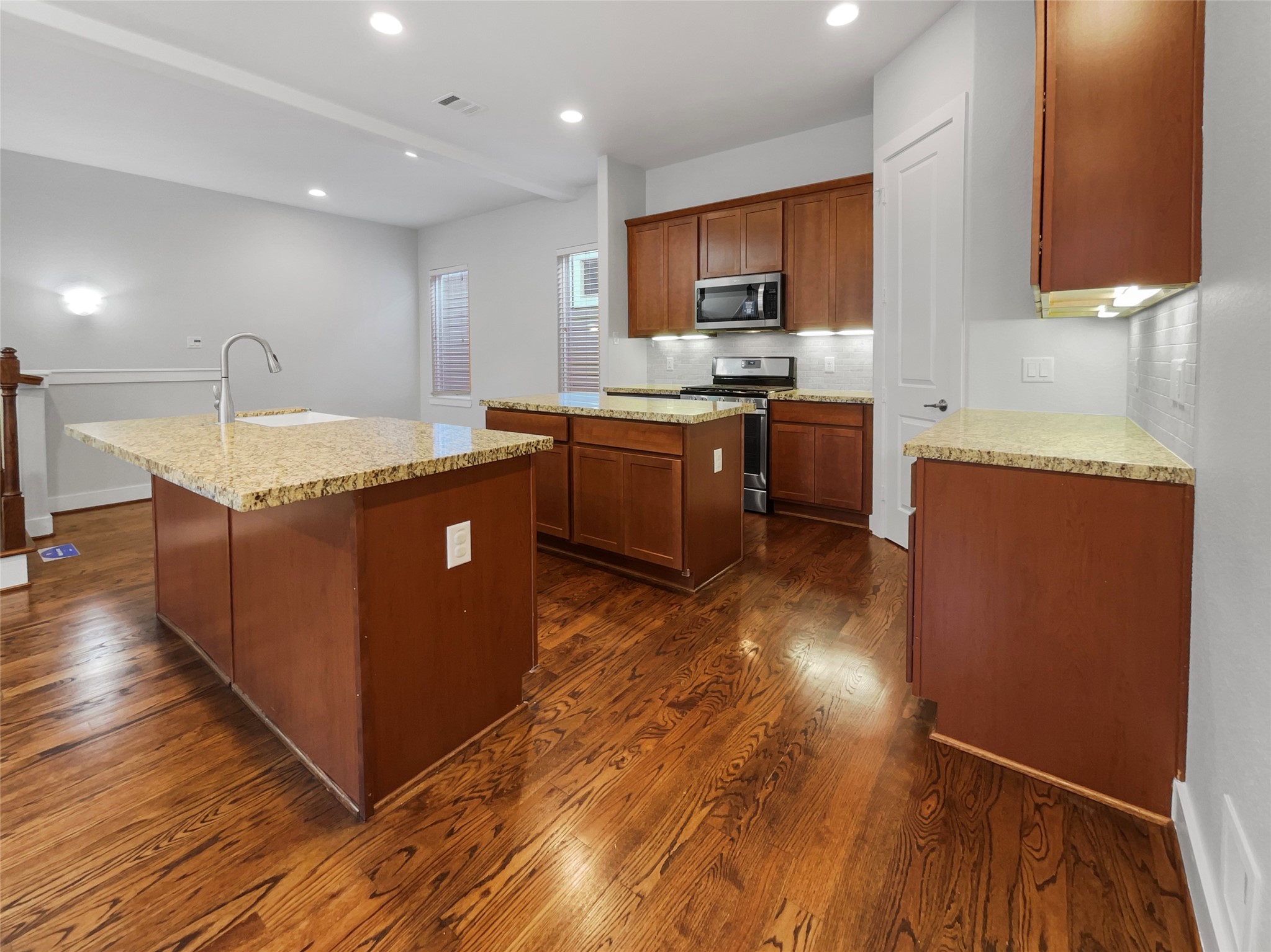 6625 Letein Street Houston, TX 77008 - Photo 14 of 17 a kitchen with granite countertop a sink counter top space and cabinets