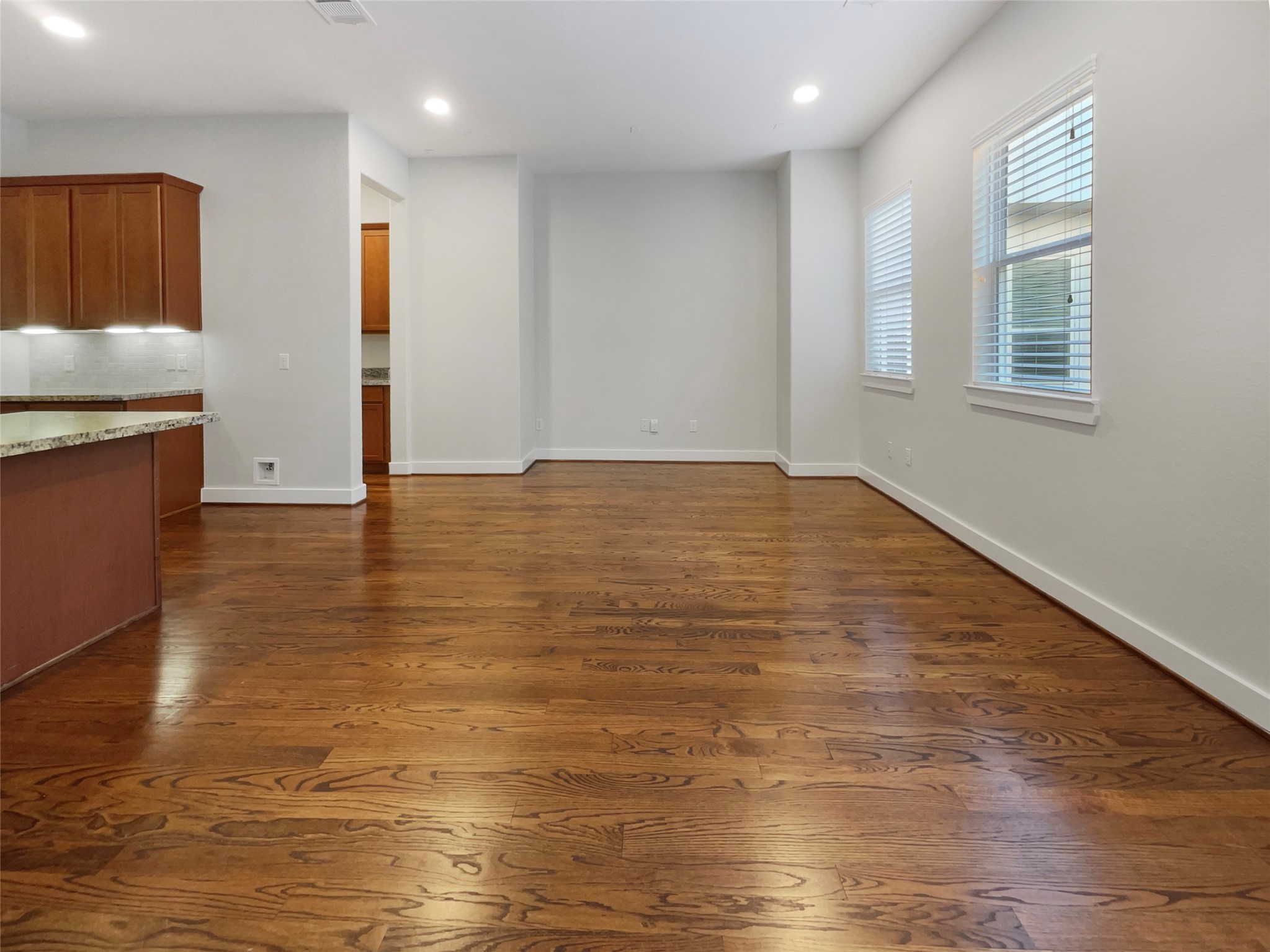 6625 Letein Street Houston, TX 77008 - Photo 15 of 17 a view of an empty room with window and wooden floor